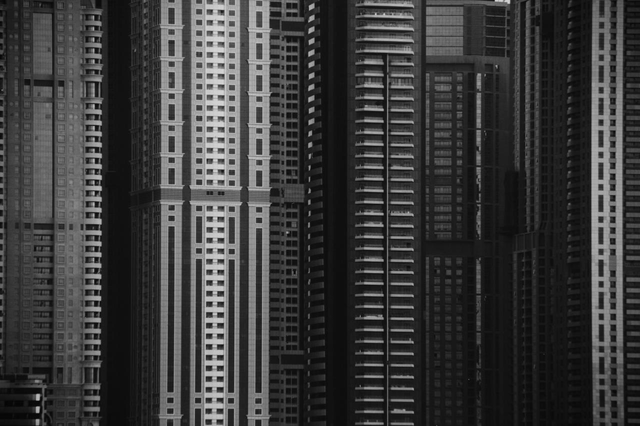 grayscale photo of high rise building