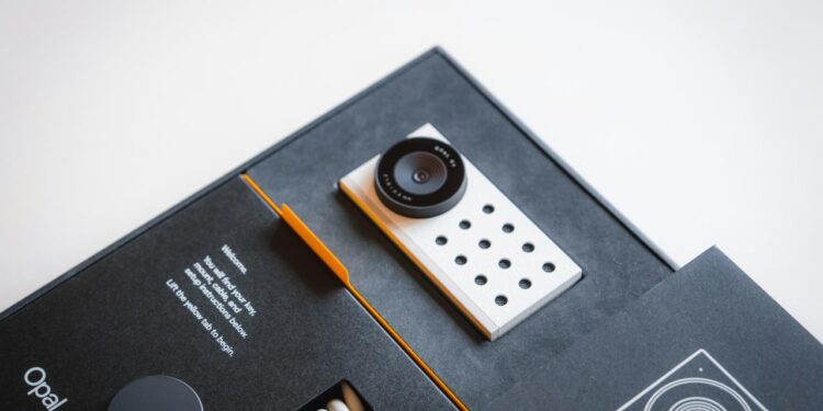 a camera sitting on top of a black box